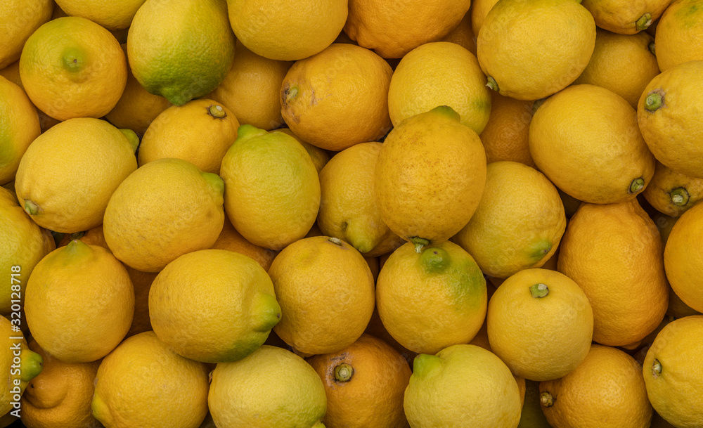 Whole fresh yellow lemons background texture Whole fresh yellow lemons background texture