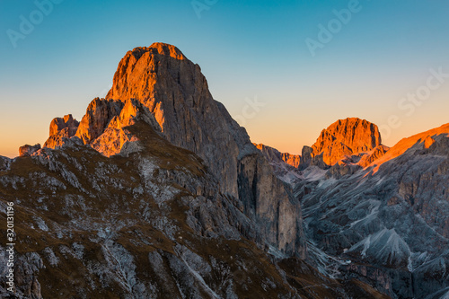 The Rosengartenspitze and Kesselkogel peaks in Catinaccio mountain group illuminated by the evening light, Dolomites (IT)