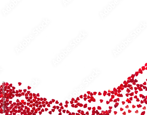 Background for Valentine's day from red sparkles in the shape of a heart on a white background with copy space for your text. Concept for valentines day. Flat lay, top view
