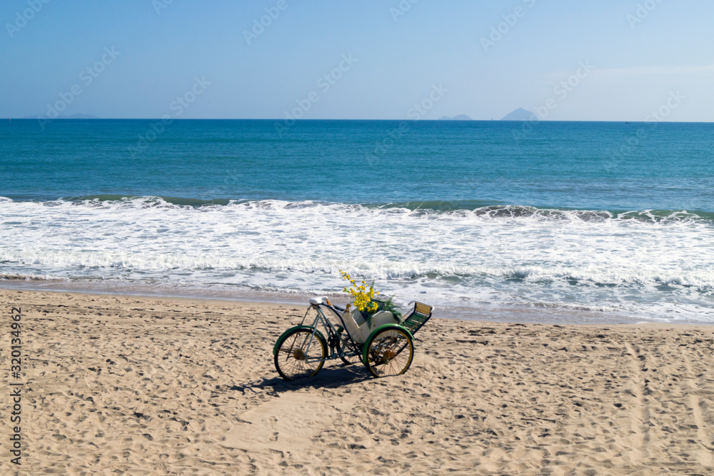 Fototapeta premium old cart by the sea beach