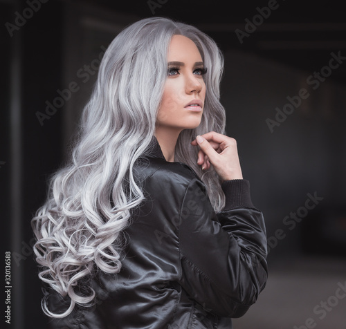 Portrait of beautiful girl with healthy long grey hair outdoor photo