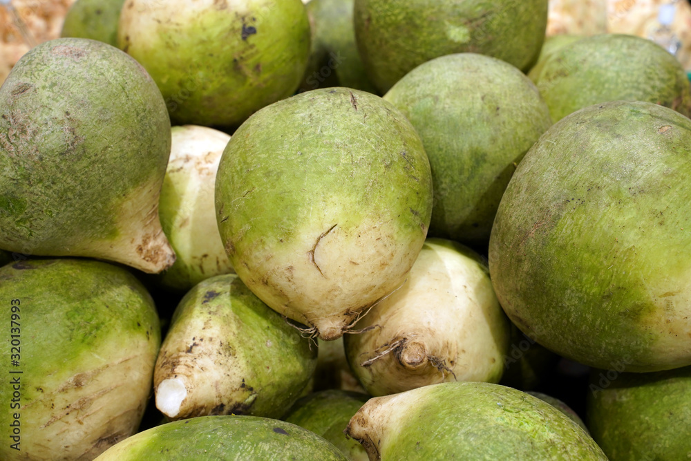 green radish on the supermarket counter green radish on the supermarket counter