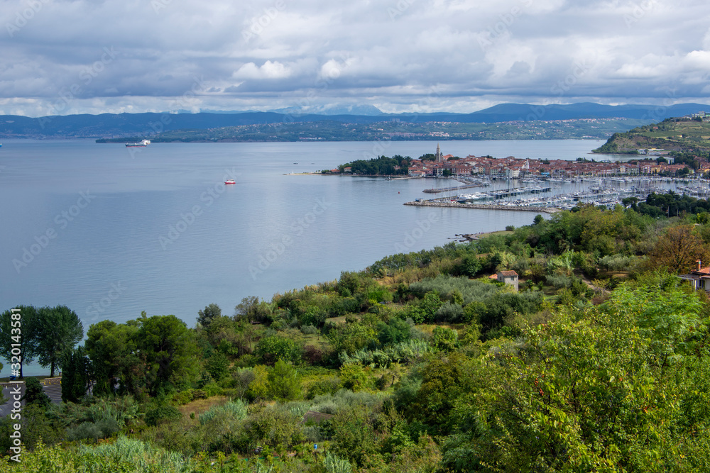 4Aerial view over the sea beautiful Izola town, with old town and harbor