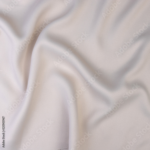 textile and texture concept - close up of crumpled gray cotton fabric background
