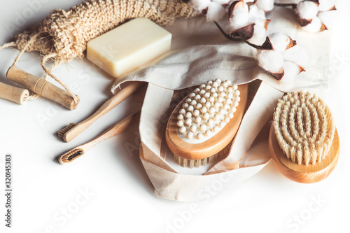 Natural brushes made of wood and soap on the background of concrete, bamboo toothbrushes PNOV2019