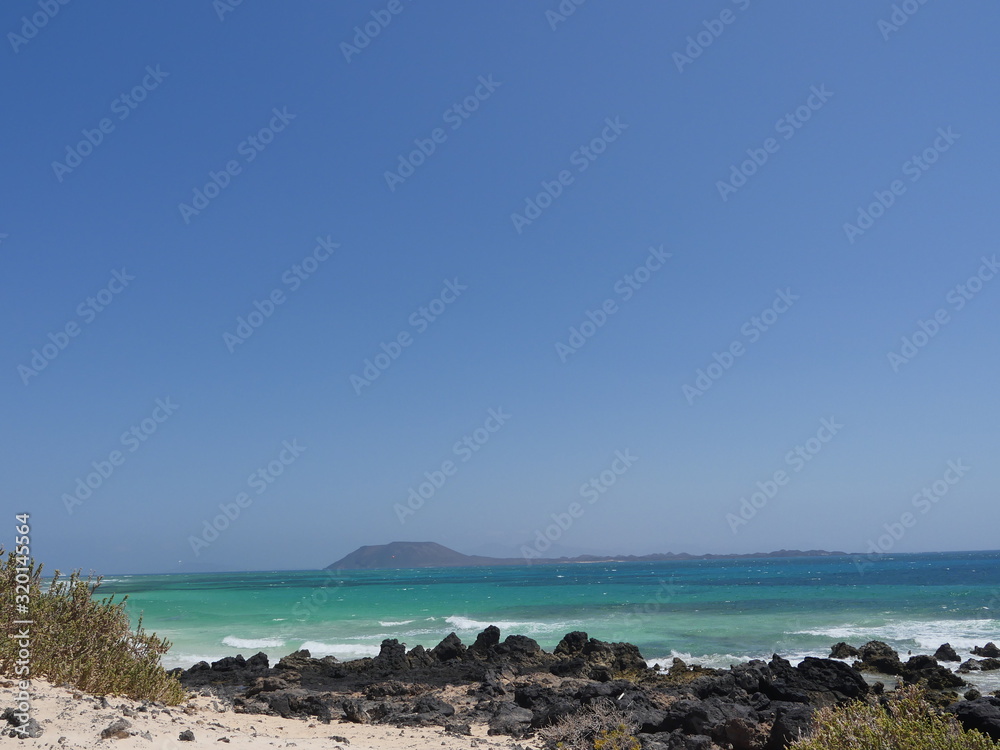 Beautiful beach of Spain, Canary Islands Fuerteventura, fine sand and crystal clear water Beautiful beach of Spain, Canary Islands Fuerteventura, fine sand and crystal clear water