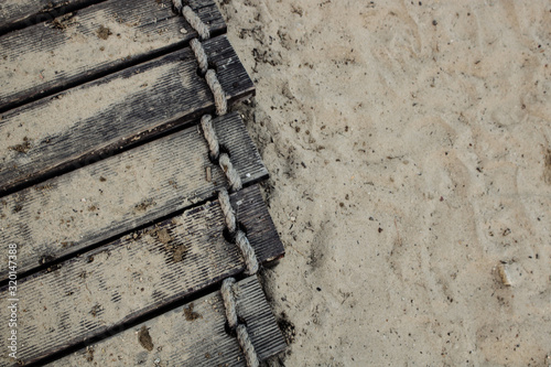 track on the beach and sand close-up from above