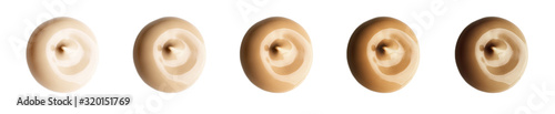 Fototapeta Set of different gently beige colours of liquid sample round drop of makeup creamy foundation isolated on white background. Cosmetic concealer. Cream texture for makeup.