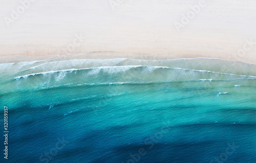 Aerial view on the coast line. Beach and sea from air as a background. Summer seascape from drone. Travel - image