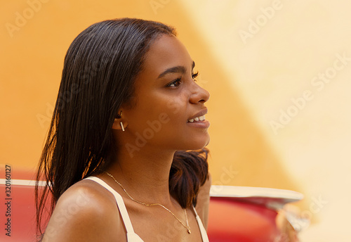 Photography beauty girl in front of old red car , cuba