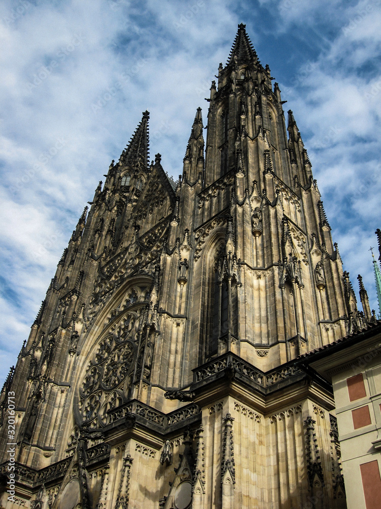 The incredible and mystical facade of the ancient Gothic St. Vitus Cathedral in Prague, the capital of the Czech Republic.