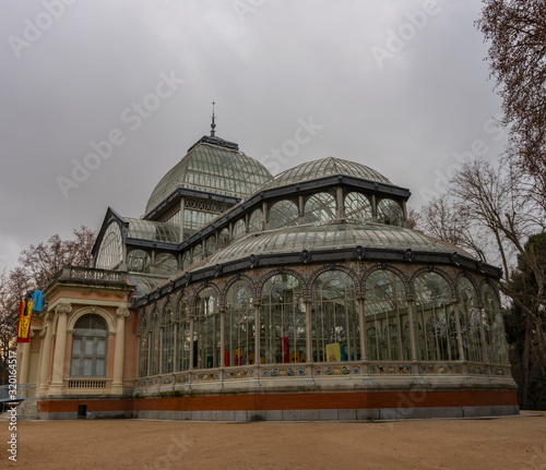 Crystal Palace in Retiro Park in Madrid at dawn on a cloudy day. Concepto viajes.