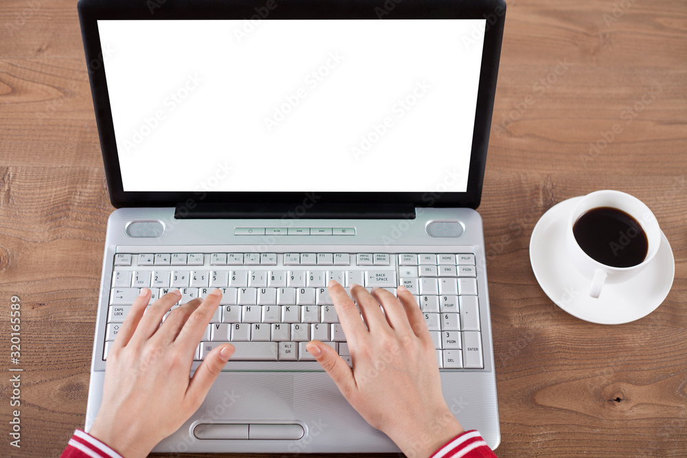 laptop and cup of coffee on table laptop and cup of coffee on table