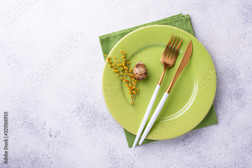 Easter table setting with green plate