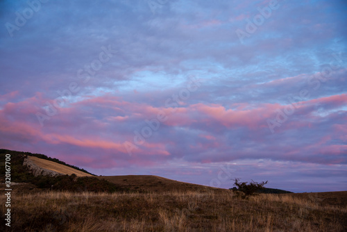 Fototapeta Naklejka Na Ścianę i Meble -  Sunset landscape on the hill