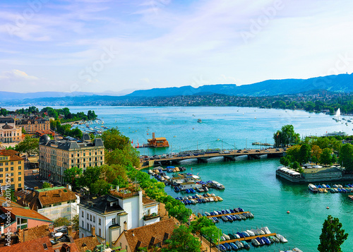 Zurich, Switzerland - September 2, 2016: Boats at Limmat River, Zurich old town, Switzerland. People on the background