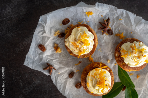 Obraz na płótnie carrot cake cupcake bite size dessert snack homemade baked dessert cream orange peel decoration board composition cafe bistro w salonie