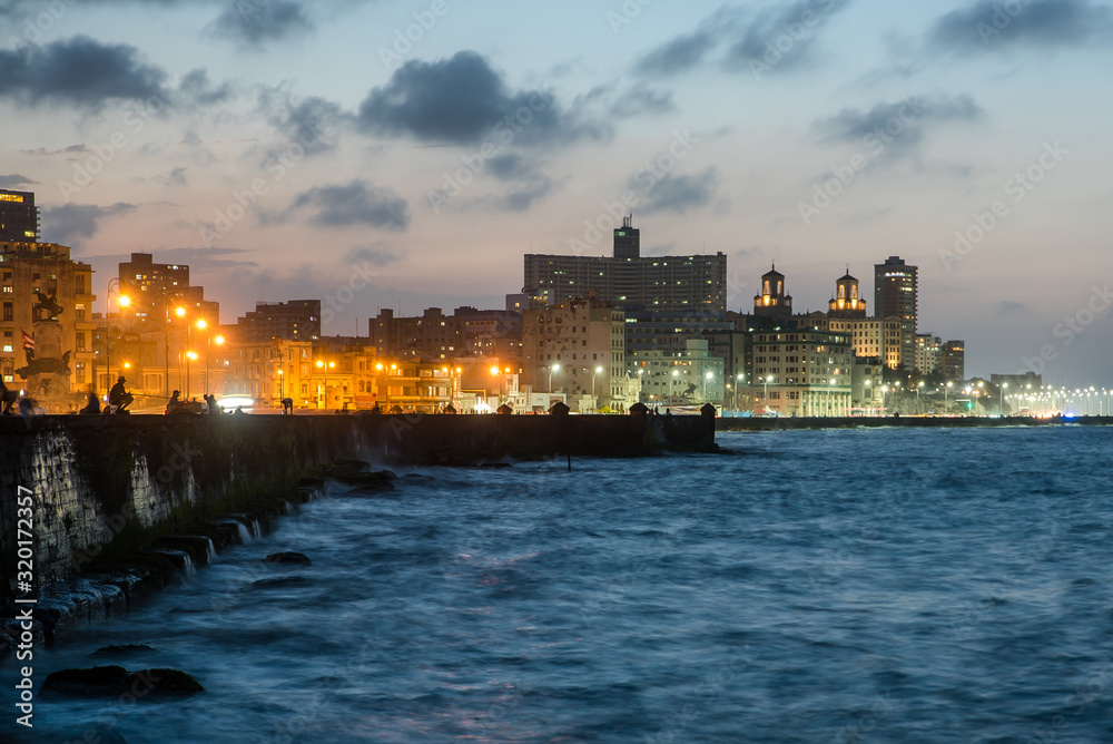 Night shot of skyline of former bussiness district Vedado in Havana taken fron Malecon sea side boulevard