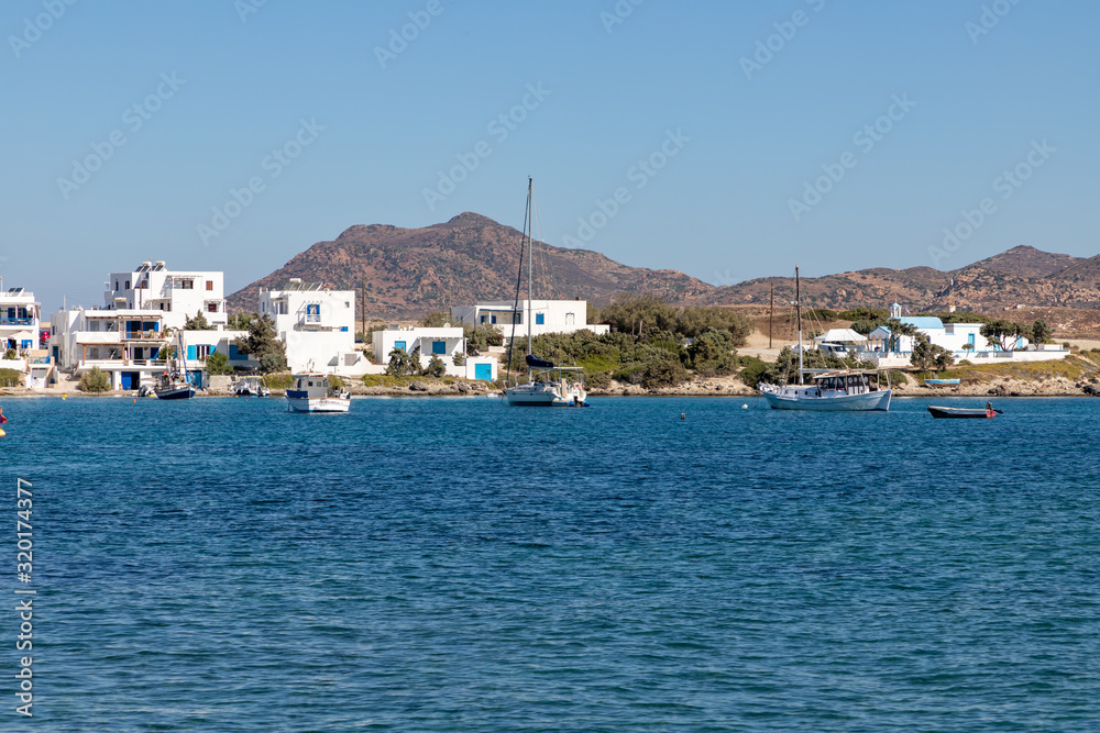 Buildings and mountains at beach in Pollonia village Buildings and mountains at beach in Pollonia village
