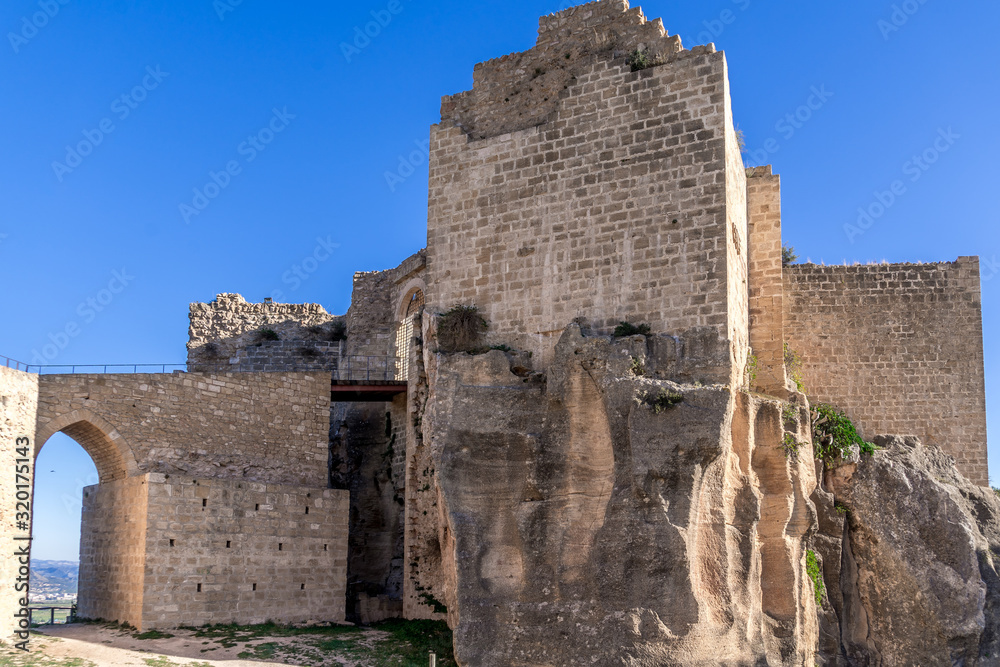 Aerial view of medieval ruined Montesa castle center of the Templar and Montesa order knights with donjon, long ramp to the castle gate in Spain