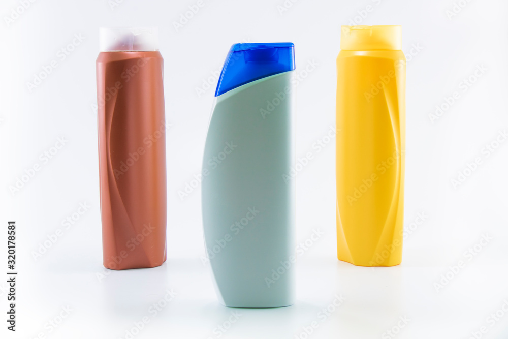 Shampoo bottles photographed on white background. Photographed in a studio setting. Shampoo bottles photographed on white background. Photographed in a studio setting.