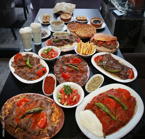 Turkish Doner Kebab with appetizer foods in restaurant table.