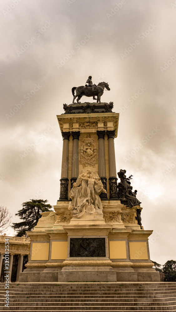 Side view of the Monument to Alfonso XII in the Retiro Park, Madrid. Travel concept.
