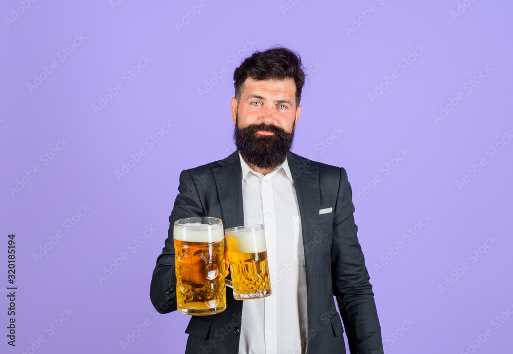 Stylish man drinking beer of glass. Beer pub. Man holds cup of beer with foam. Alcohol. Lager and dark ale. Bearded man drinking craft ale from mug. Germany traditions. Oktoberfest. Beer in glass. Stylish man drinking beer of glass. Beer pub. Man holds cup of beer with foam. Alcohol. Lager and dark ale. Bearded man drinking craft ale from mug. Germany traditions. Oktoberfest. Beer in glass.
