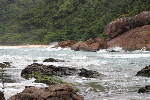 Trindade, Paraty/Rio de Janeiro/Brazil - 01-19-2020: Praia do Meio beach. Strong waves, dangerous sea, drowning risk, sorrounded by many rocks
