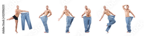 Man in dieting concept with oversized jeans