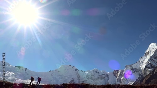 Hikers walking in the mountains. Himalayas, Everest Base Camp trek, Nepal