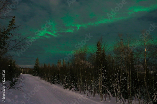 Northern lights on the background-night mountains © Kateryna