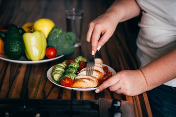 Diet concept, healthy lifestyle, low calorie food. Woman dieting. Closeup portrait of girl eating healthy food