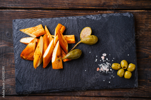 Traditional Caucasian smoked Chechel cheese. Beer snack, tasty food photo