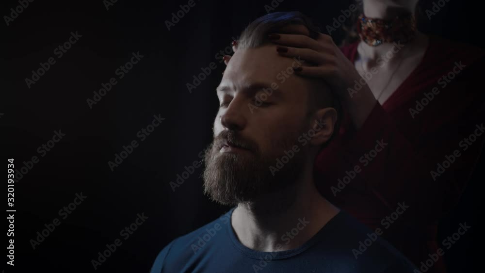 Hands of woman touching man's beard, slow motion Hands of woman touching man's beard, slow motion