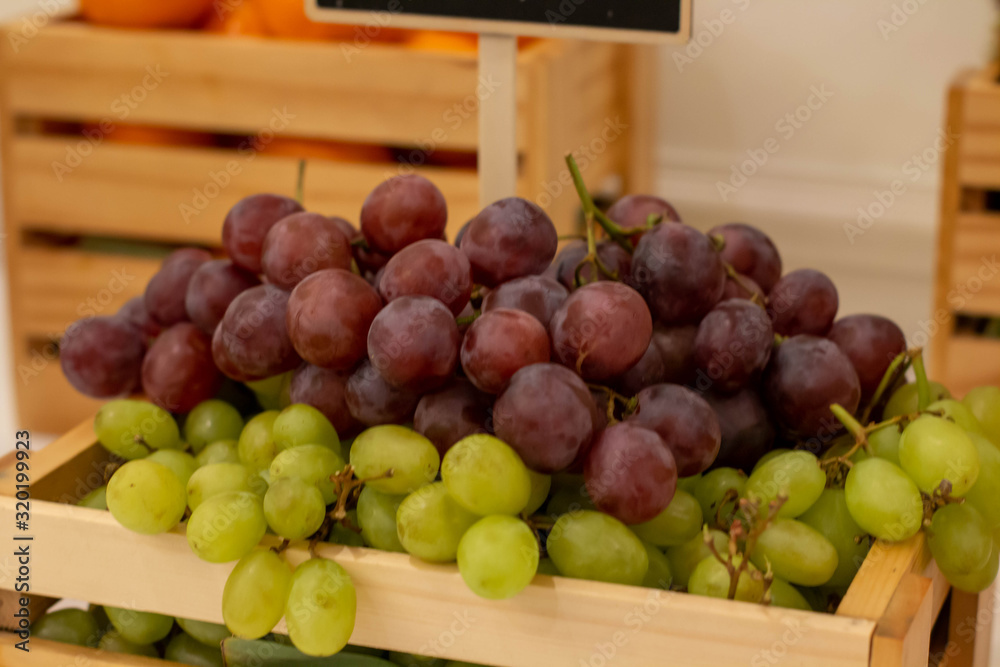A mixed fresh fruit in wood box A mixed fresh fruit in wood box