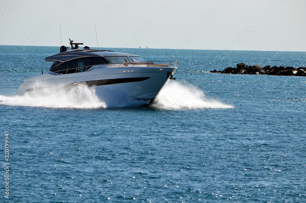High-end cabin cruiser racing through Government Cut in Miami,Florida High-end cabin cruiser racing through Government Cut in Miami,Florida