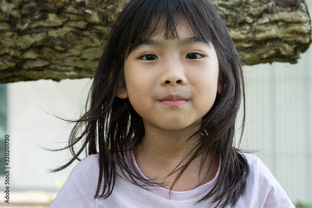 Portrait little girl Asian happy smile 7 years old