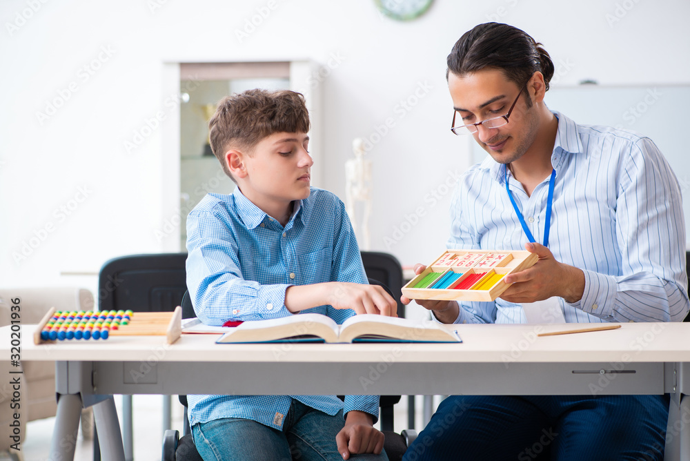 Young father helping his son to prepare for exam Young father helping his son to prepare for exam