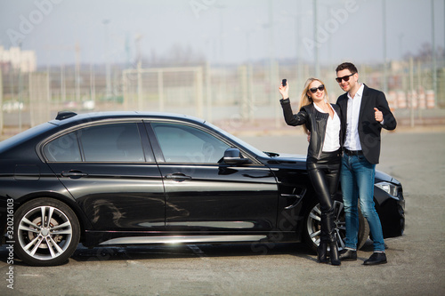 Happy couple buy new modern black car © Maksymiv Iurii