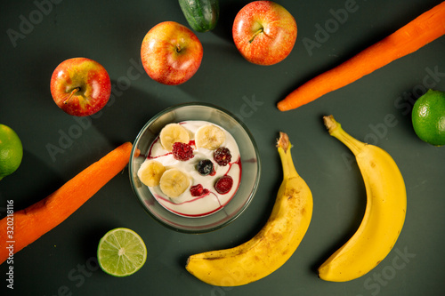 Healthy life with healthy foods like apple, carrot, berry, blackberry yoghurt and cereals