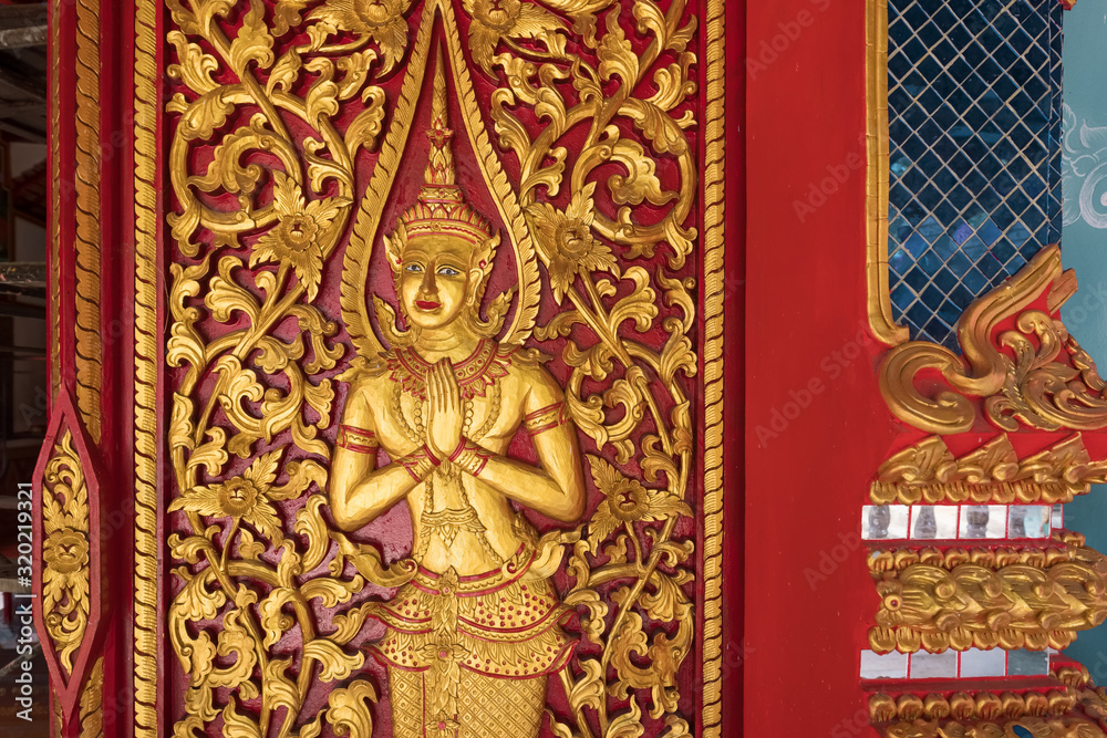 Golden carving decoration on the Buddhist temple in Thailand