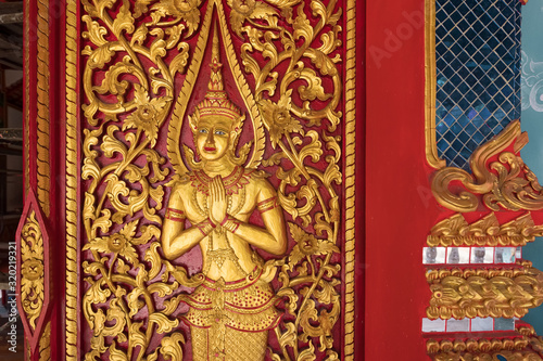 Golden carving decoration on the Buddhist temple in Thailand