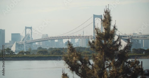 Rainbow Bridge in Tokyo, Japan. The suspension bridge was shot from Odaiba 4K DCI cinematic slow motion