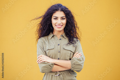 Obraz na plátně Young Arab Woman with curly hair outdoors