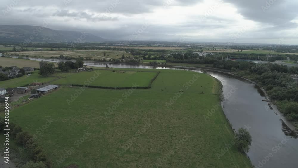 Aerial shot flying east over the river forth and farmland on an overcast day Aerial shot flying east over the river forth and farmland on an overcast day