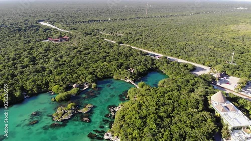 Drone footage of forest road and lake photo