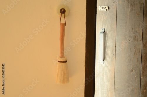 Broom hung on the wall