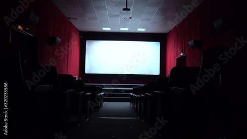 Empty movie theater, watching a movie. cinema hall. Viewers watch a movie in a movie theater. Filmmakers watch the film on an empty screen