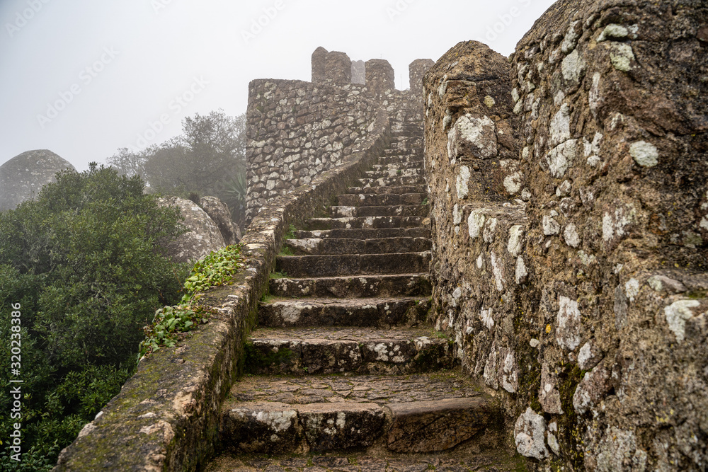 Steps leading up to the highest point at the ruins of the Moorish Castle, in the fog Steps leading up to the highest point at the ruins of the Moorish Castle, in the fog
